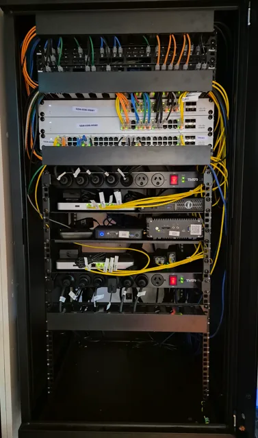 Retail network cabinet after remediation: full rack build, documented