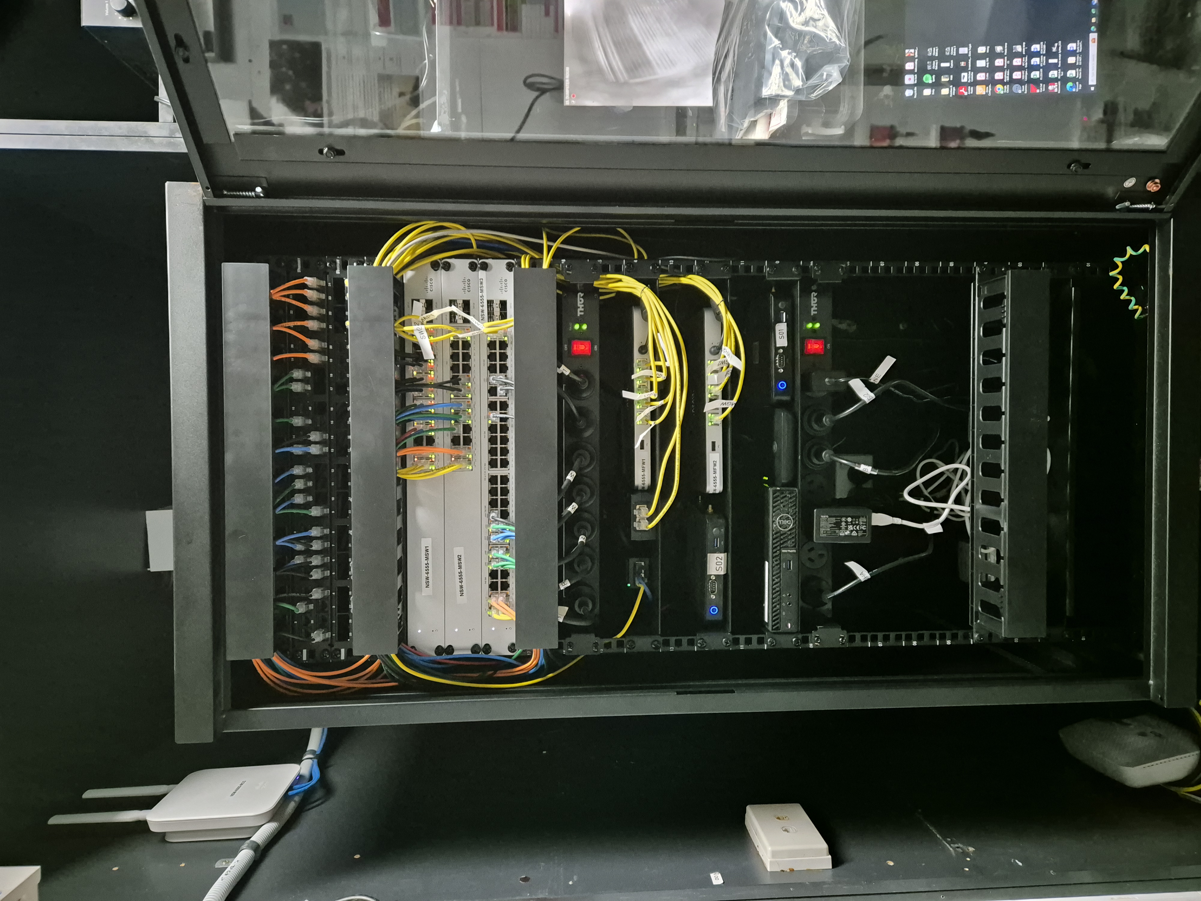 After — full rack build, triple-redundant internet, yellow fibre, professionally documented